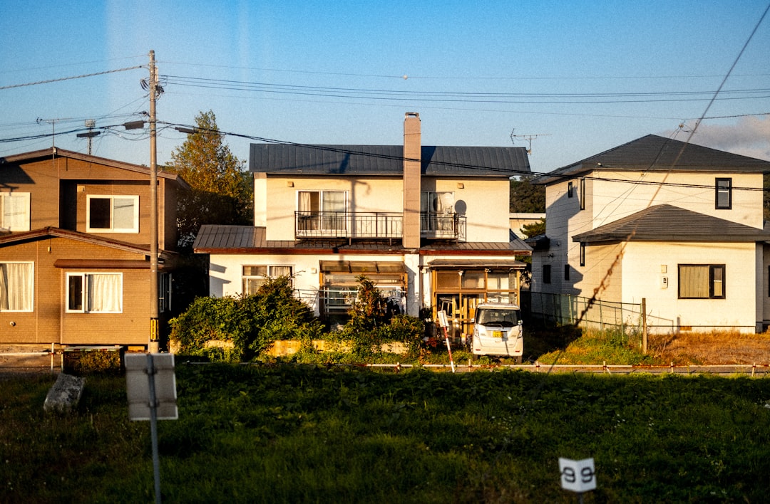 A beautiful, modern suburban home, typical of the Indianapolis area, with excellent curb appeal on a bright, sunny day, representing a seller's valuable asset.
