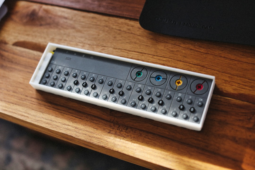Sleek, modern calculator and a set of house keys resting on a clean, bright desk, symbolizing the smart financial calculat...