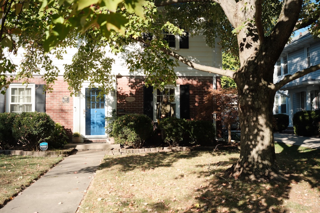 A beautiful modern suburban home, typical of an Indianapolis neighborhood, with a 'For Sale' sign in the yard representing the seller's valuable equity.