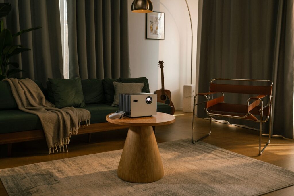 Savvy homeowner sits in their bright, modern living room, using a tablet to research efficient ways to sell their Indianap...