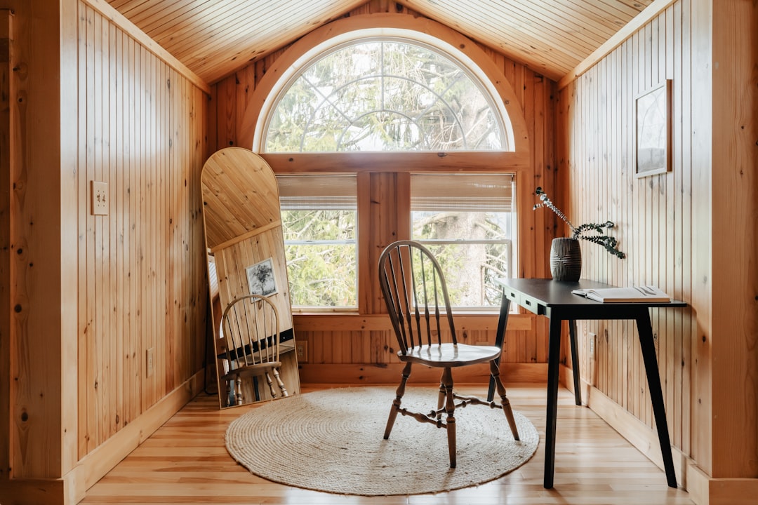 An empty, traditional, and expensive-looking brokerage office with wood-paneled walls, symbolizing the outdated overhead costs of old-school real estate models.
