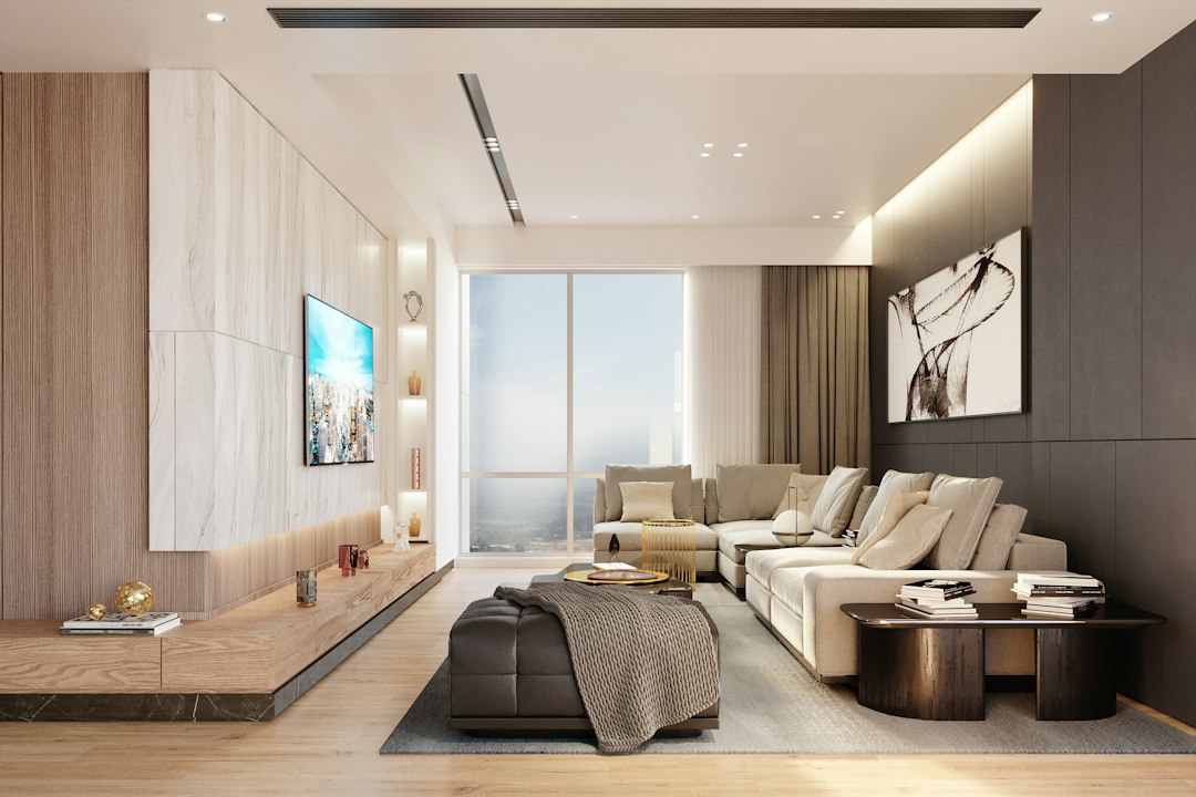An airy and modern living room with floor-to-ceiling windows letting in bright natural light, representing the concept of complete transparency in a home sale.
