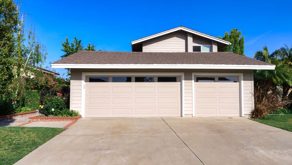 A beautiful suburban home in Indianapolis with great curb appeal on a sunny day, representing the high-value asset protected by a smarter commission model.