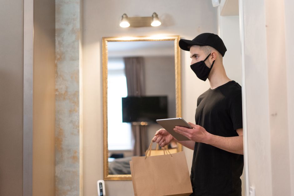 A real estate professional showcases a superior marketing plan on a tablet inside a beautiful Indianapolis home, highlighting a modern, tech-forward sales strategy.