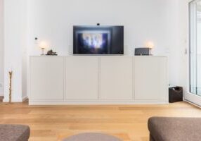 Bright, minimalist living room in a modern home, symbolizing the lean and efficient approach to selling real estate in Ind...